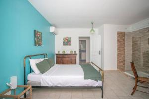 Postel nebo postele na pokoji v ubytování Villa Sol Y Sombra