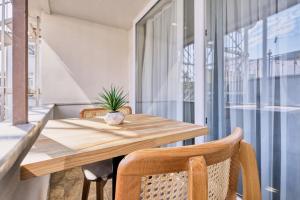 a dining room with a wooden table and chairs at Hub Suite Istanbul in Istanbul