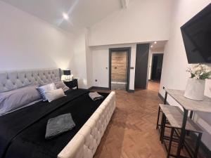 Ένα ή περισσότερα κρεβάτια σε δωμάτιο στο Marmalade Barn Guest Suite with wet room
