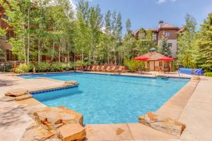 a swimming pool in a yard with a house at Snowy Spruce Sanctuary in Edwards
