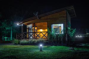 a house at night with a light in the yard at La Bella Vista in Urubici +34 photos