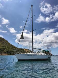 a sailboat sitting in the water on the ocean at Boat Vogue à Lame in Gourbeyre