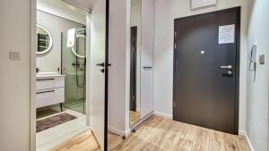 Koupelna v ubytování Rezydencja Niechorze 112 z ogródkiem - 5D Apartamenty + 21 fotografií