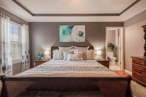 a bedroom with a large bed in a room at Hot Tub Hideaway 3 BR in Jeffersonville