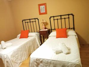 Postel nebo postele na pokoji v ubytování Casa Pelayo 2