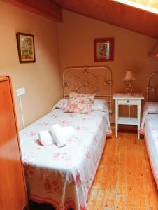 Postel nebo postele na pokoji v ubytování Casa Pelayo 2