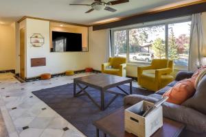 a living room with a couch and a table at Spacious Reno Vacation Rental about 3 Mi to MidTown! in Reno
