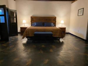 Ένα ή περισσότερα κρεβάτια σε δωμάτιο στο Posada 1885