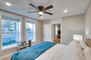 a bedroom with a bed and a ceiling fan at Stylish Logan Retreat with Smart TV and Central A and C! in Logan