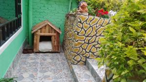 a dog house sitting on the side of a balcony at Casa Shalom R.G. in Paipa