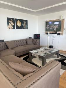 a living room with a couch and a coffee table at Habitación de Lujo con vista al Rio Parana in Paraná