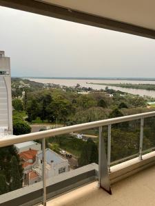 a view of the ocean from a balcony of a building at Habitación de Lujo con vista al Rio Parana in Paraná