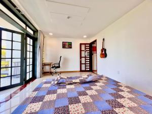 Ein Bett oder Betten in einem Zimmer der Unterkunft KENPI Homestay
