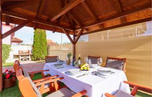 a table with a white table cloth on a patio at 2 Bedroom Gorgeous Home In Zagreb in Zagreb