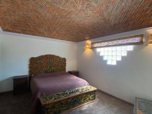 Postel nebo postele na pokoji v ubytování Casa Árbol Hotel