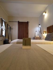 Cama o camas de una habitación en Añoranza Hotel Boutique