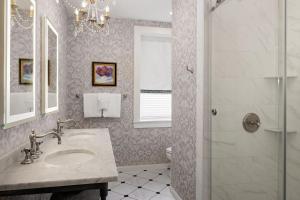 a bathroom with a sink and a shower at Hamilton Turner Inn in Savannah