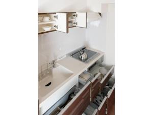 a kitchen with a sink and a counter at WALLABY HOUSE - Vacation STAY 38655v in Kawaguchi