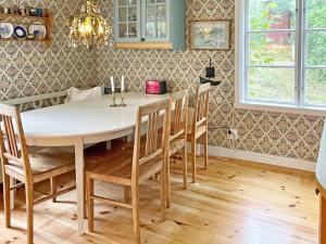 a dining room with a table and chairs at 6 person holiday home in LOFTAHAMMAR-By Traum in Loftahammar