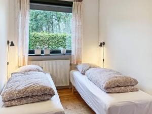 Säng eller sängar i ett rum på Holiday home Tønder III