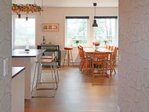 a kitchen and dining room with a table and chairs at 4 star holiday home in Frillesås-By Traum in Frillesås