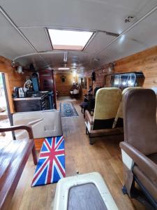 an inside view of an rv with a flag on the floor at Routemaster in Gramado