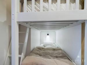 a white bunk bed in a white room at Studio Montvalezan-La Rosière, 1 pièce, 4 personnes - FR-1-398-660 in Montvalezan
