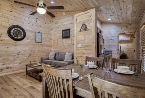 A seating area at Jolly Jingle Cabin, Pickleball Court, Creek, WIFI, Mountain Views, Starting at 79"