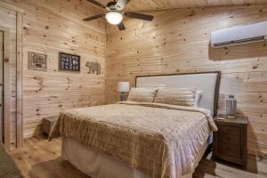 A bed or beds in a room at Jolly Jingle Cabin, Pickleball Court, Creek, WIFI, Mountain Views, Starting at 79"