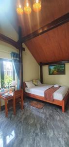 Postel nebo postele na pokoji v ubytování Tam's Homestay