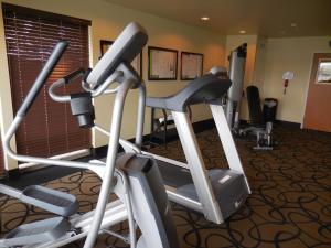a gym with two exercise bikes in a room at Aspen Suites Hotel Haines in Haines