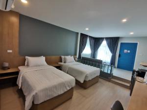 Ένα ή περισσότερα κρεβάτια σε δωμάτιο στο Soi9 poshtel