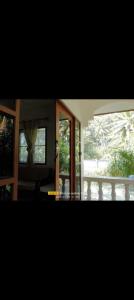 a view of a living room with a large window at 2 one bedroom houses 400 meters from the deach in Amphoe Koksamui