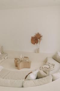 a white living room with a white couch at MAJA Canggu in Canggu