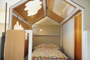 Postel nebo postele na pokoji v ubytování Taitung Ohana Sky Hostel