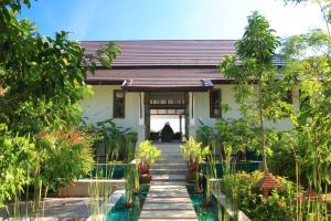 a house with a pathway leading to the front door at Ban Laem Set - by Sublime Samui Villas in Laem Set Beach