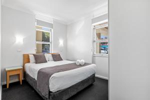 Postel nebo postele na pokoji v ubytování Taft Apartments