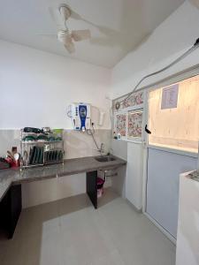 a kitchen with a counter top in a room at Good Stay 2BHK Apartment - 702 in Dabolim
