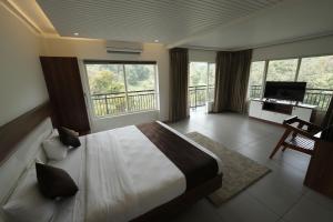 A bed or beds in a room at jungle view resort