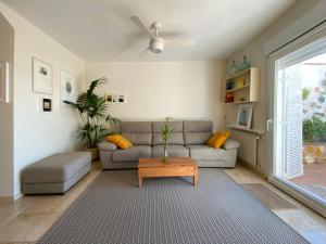 a living room with a couch and a coffee table at VillaSanMiguelAlto in Granada