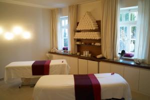Posteľ alebo postele v izbe v ubytovaní Romantik Residenz (Ferienwohnungen Hotel Im Weissen Rössl) - Dependance