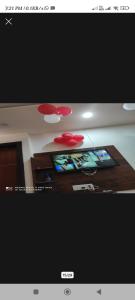 a picture of a living room with a tv at V.S guest houes in Palwal