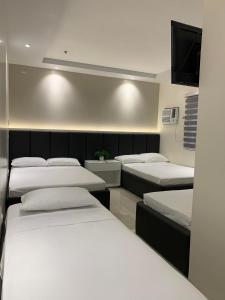 Letto o letti in una camera di Central Block Inn