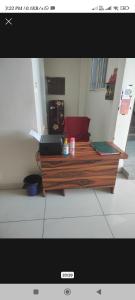 a living room with a coffee table with a laptop on it at V.S guest houes in Palwal