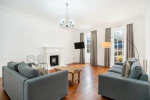 a living room with two couches and a table at The Place Hotel in Edinburgh