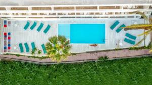 an overhead view of a building with a swimming pool at Azure Mare Hotel in Hersonissos