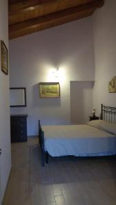Postel nebo postele na pokoji v ubytování B&B La Taverna