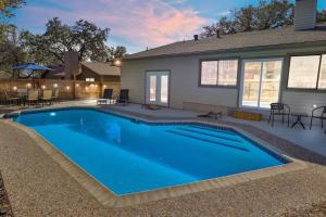 a swimming pool in front of a house at San Antonio Escape in San Antonio