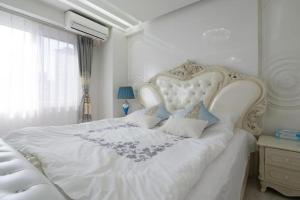 Ένα ή περισσότερα κρεβάτια σε δωμάτιο στο Reimi Mondo301