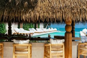 a resort with a row of chairs and a pool at Zazen Boutique Resort & Spa in Bophut